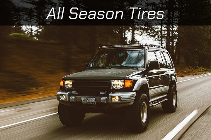 An image of a vehicle driving through the forest with all season tires.